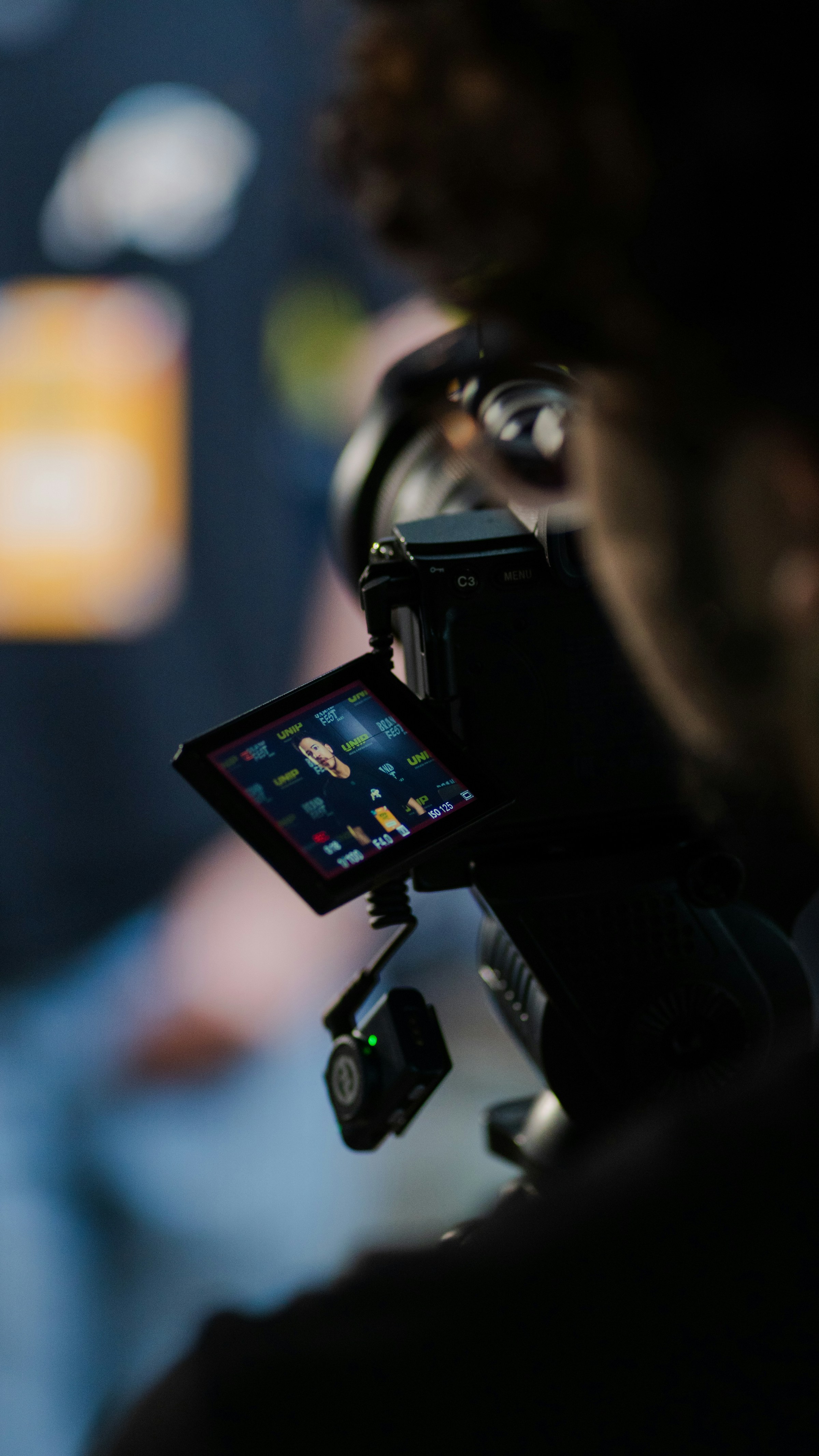 A camera operator filming a seated interview